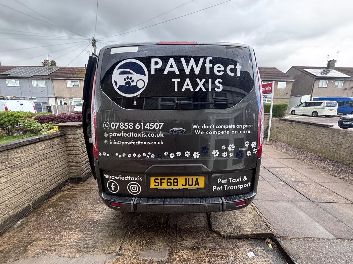 Rear view of Pawfect Taxis branded Ford Tourneo Custom pet transport van